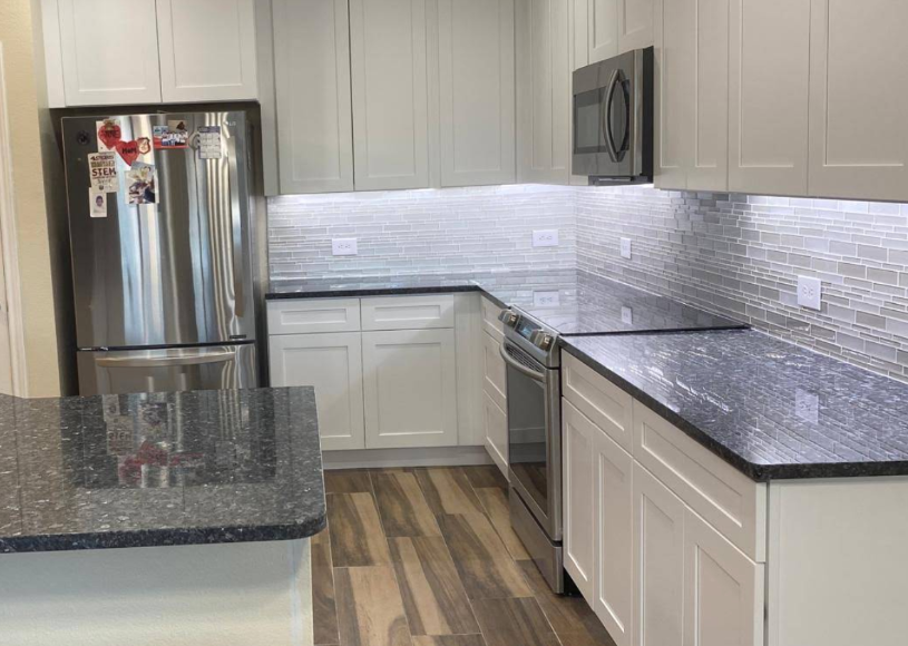White cabinets with dark granite countertops kitchen remodel - UST Kitchen & Bath project