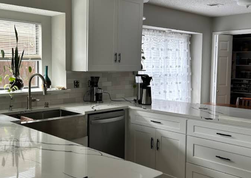 White U-shaped kitchen remodel with ample cabinetry and counter space - UST Kitchen & Bath project